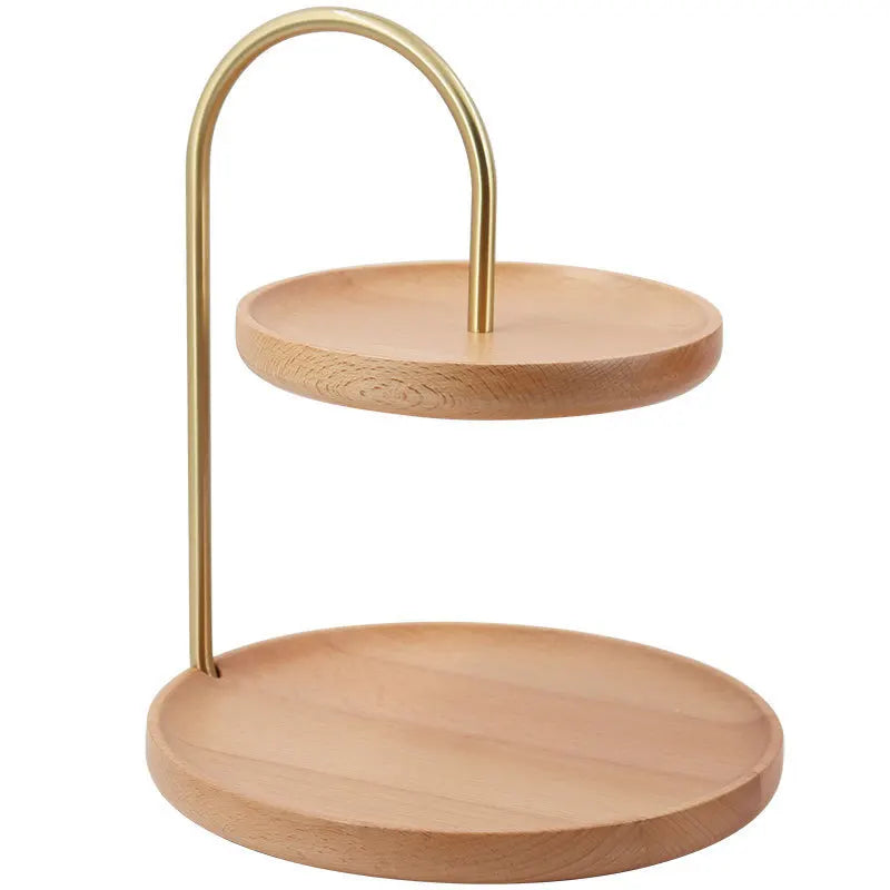 Two-tiered wooden stand with gold metal handle on a white background