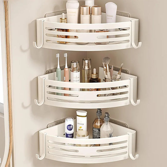 White corner shower caddy with various toiletries on a beige wall.