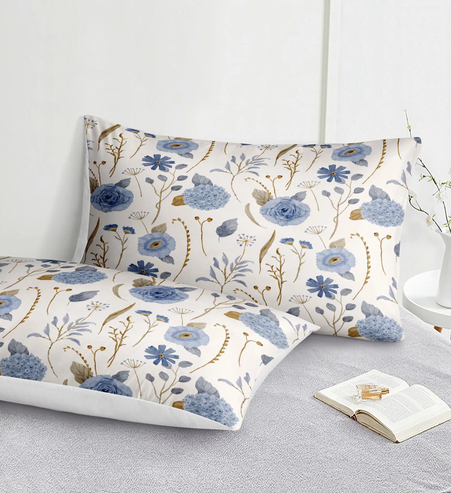 Floral patterned pillowcases on a bed with an open book.