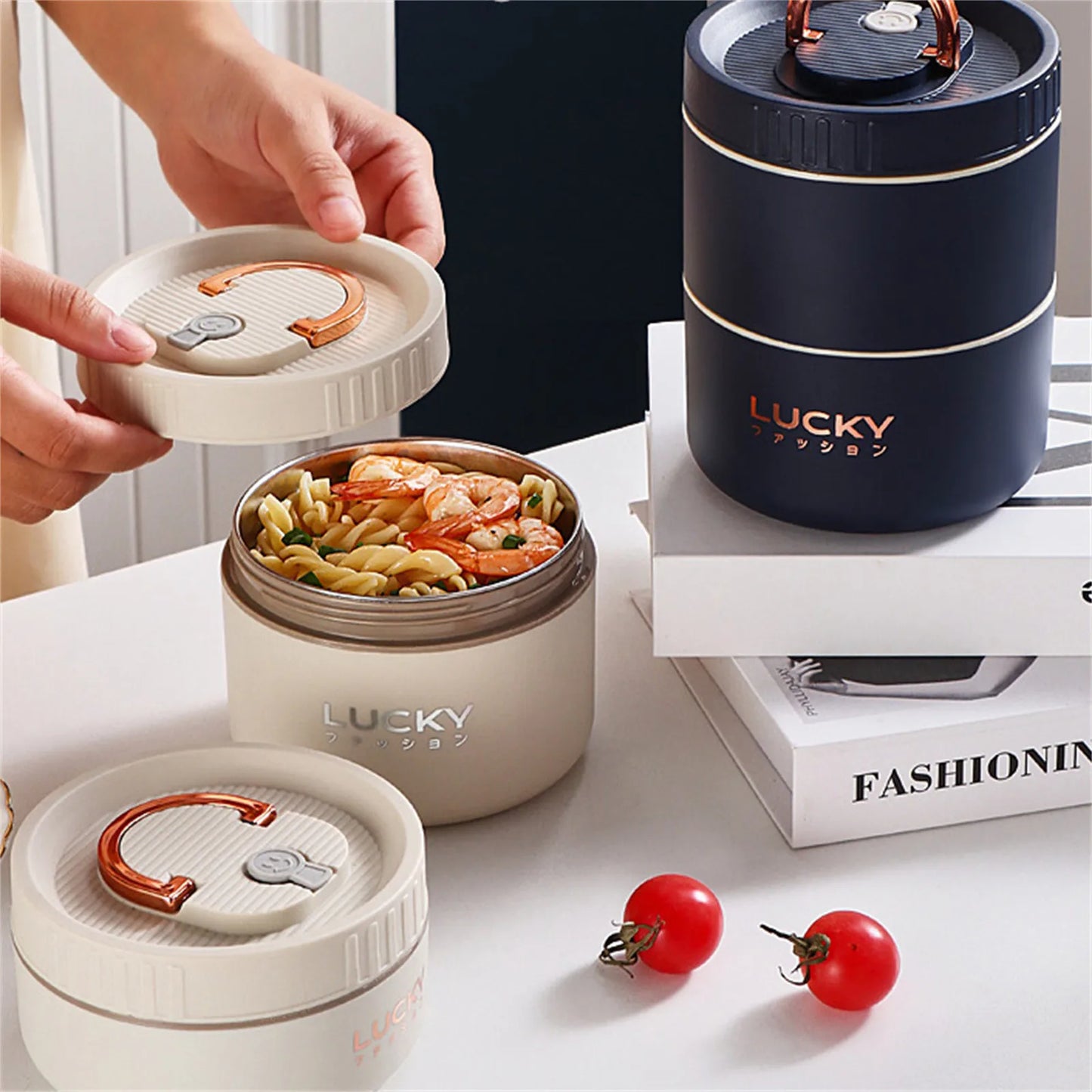 Lucky brand food containers with pasta and tomatoes on a table