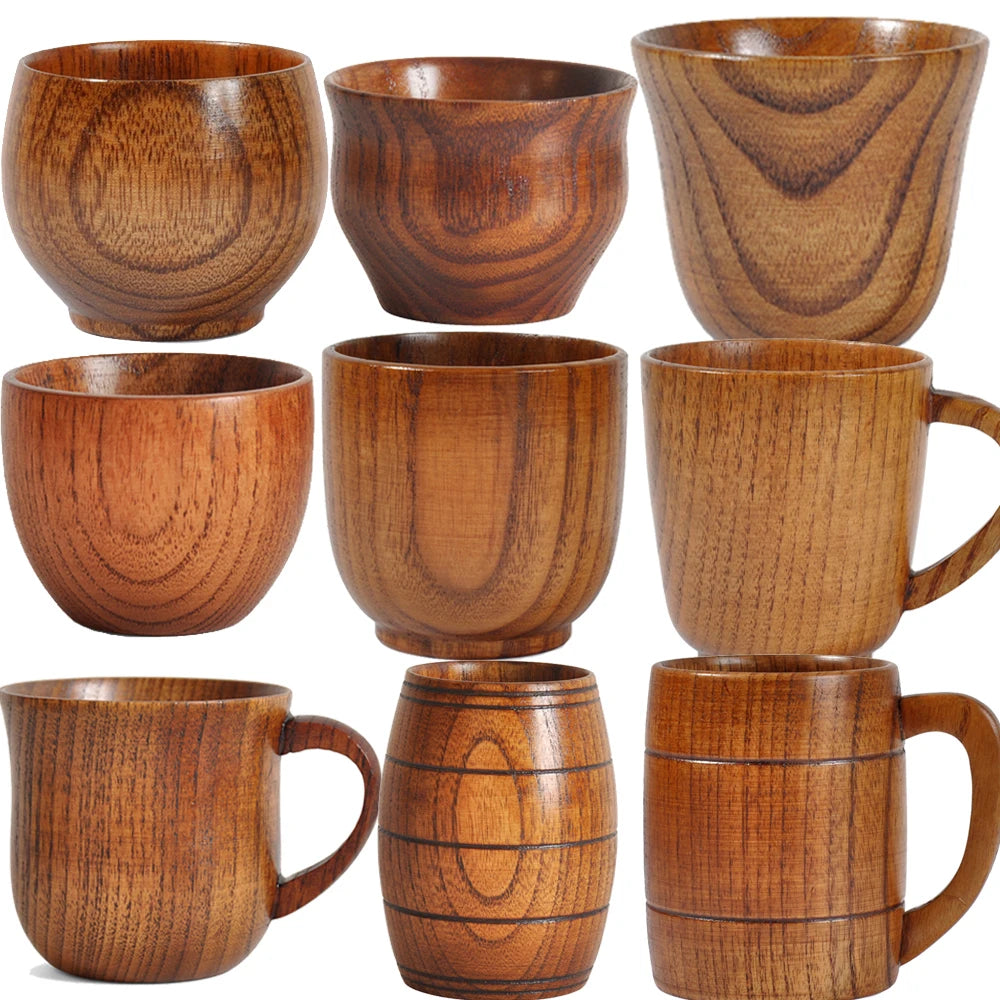 Set of wooden mugs and bowls with a natural wood finish.