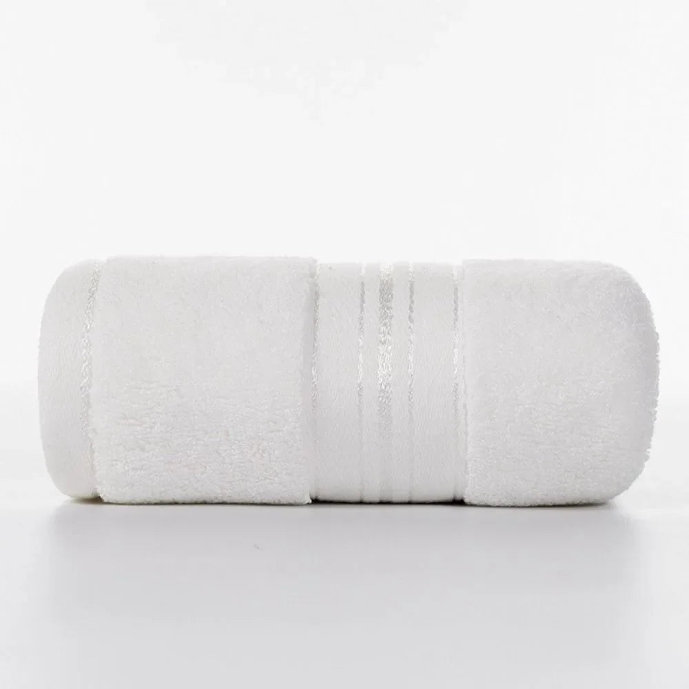 White towel rolled up on a white background