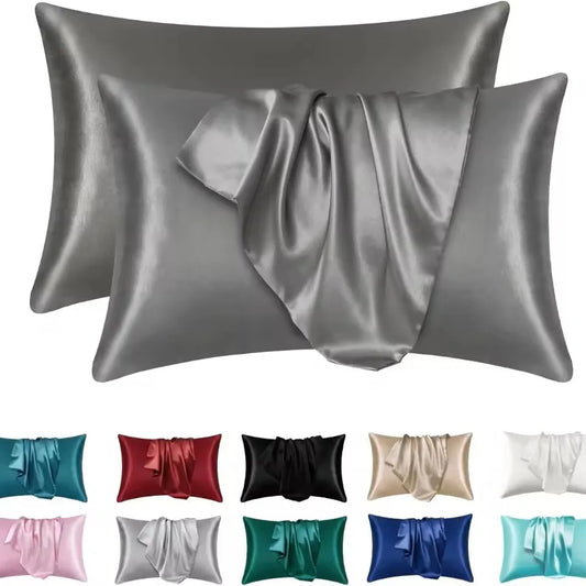 Gray satin pillowcases with color swatches below on a white background