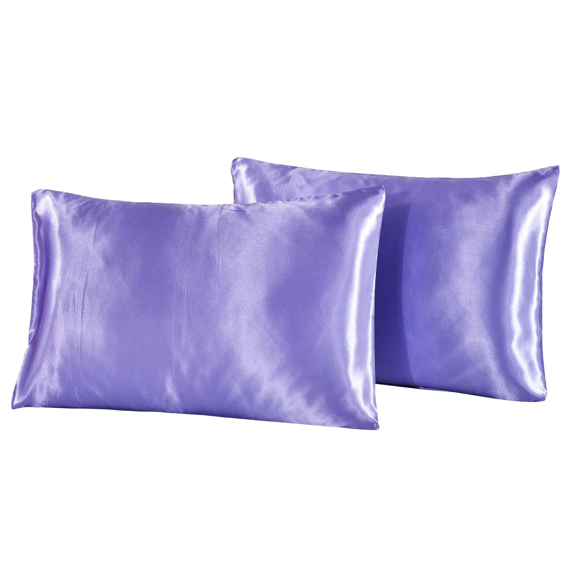 Two purple satin pillowcases on a white background