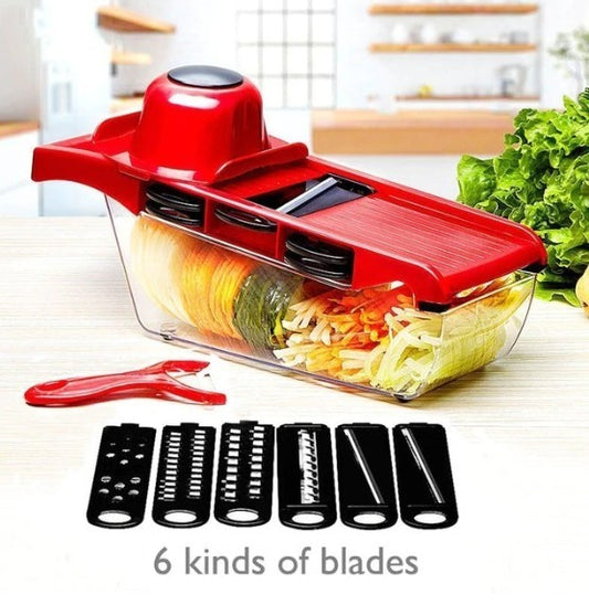 Red mandoline slicer with adjustable blades on a kitchen counter