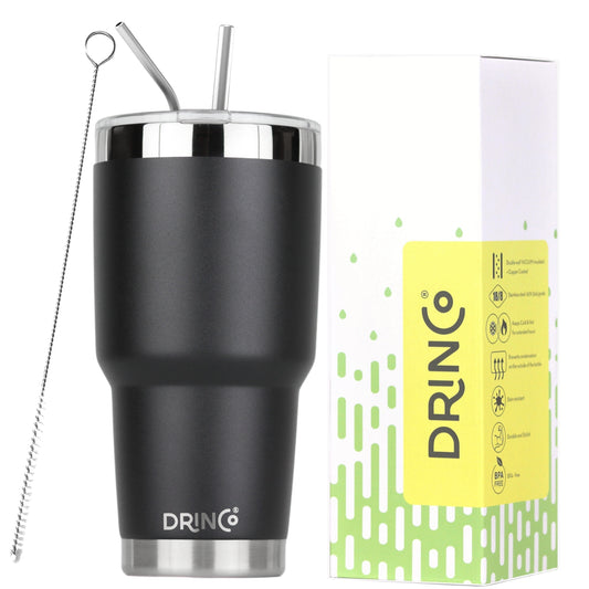 Black insulated tumbler with silver rim and straws, next to DRINCO packaging on a white background