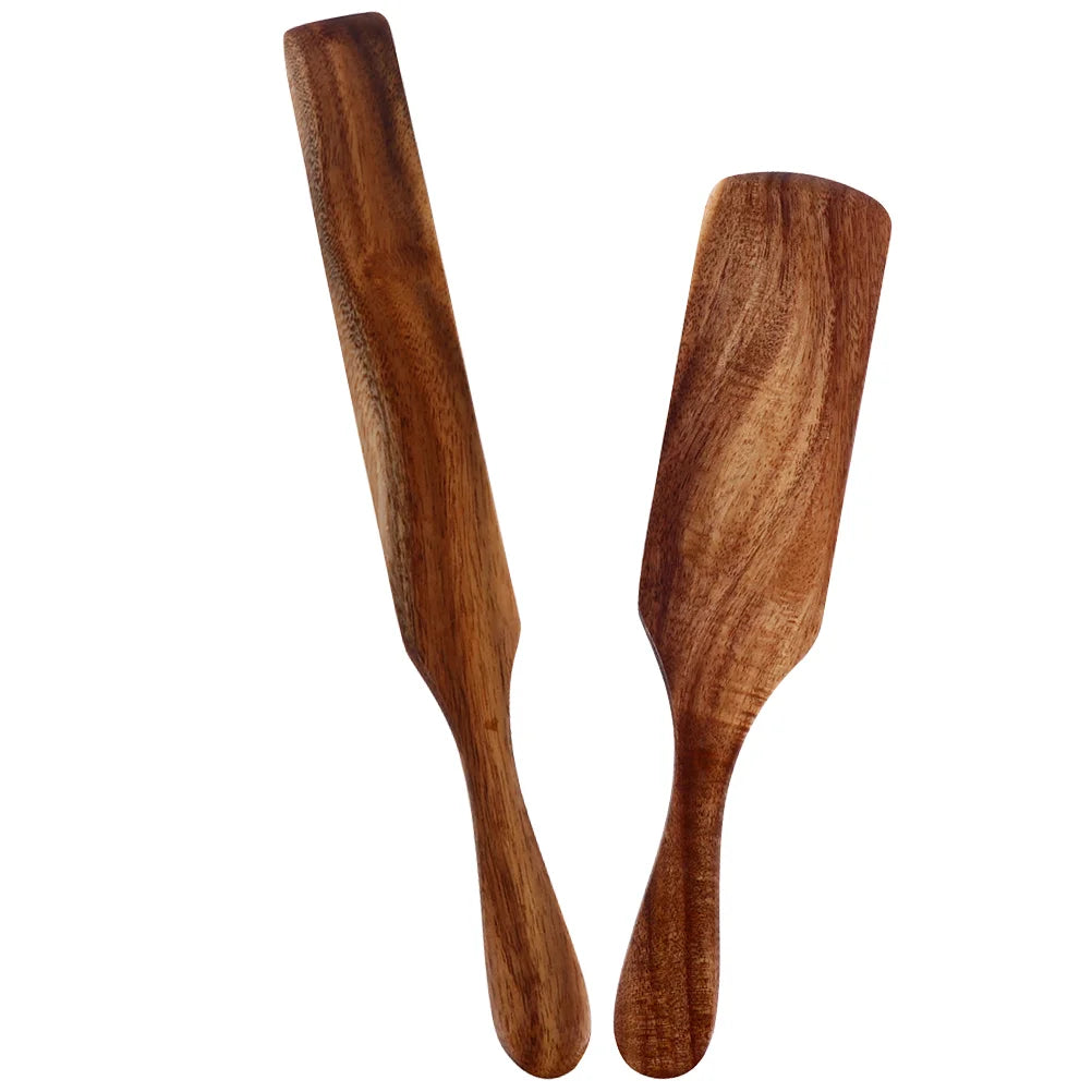 Two wooden spatulas on a white background