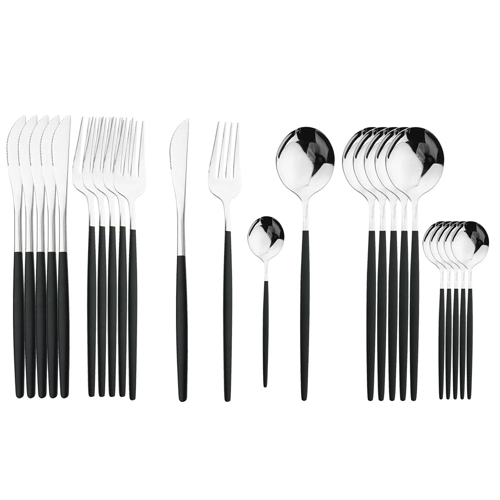 Set of silver cutlery with black handles on a white background
