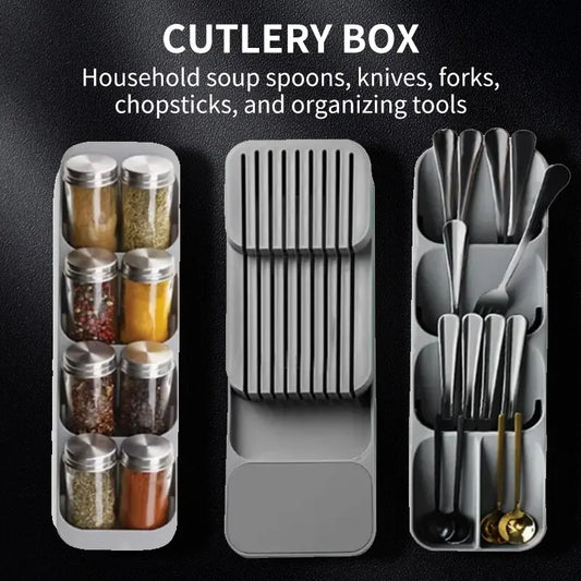 Cutlery organizer with compartments for spoons, knives, forks, and chopsticks on a black background.