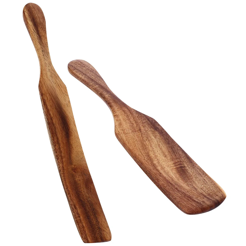 Two wooden spatulas on a white background