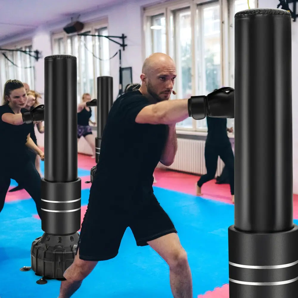 Freestanding Punching Bag 71 Inch Boxing Bag with 25 Suction Cups Gloves and Filling Base - Black - Boxing & Martial