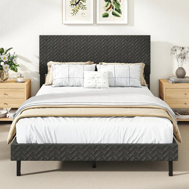 Gray upholstered bed with white bedding in a bedroom setting