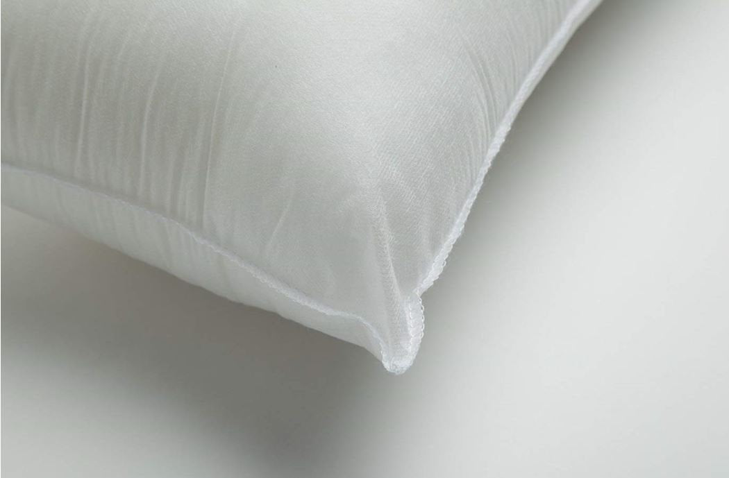 White pillow on a light gray background