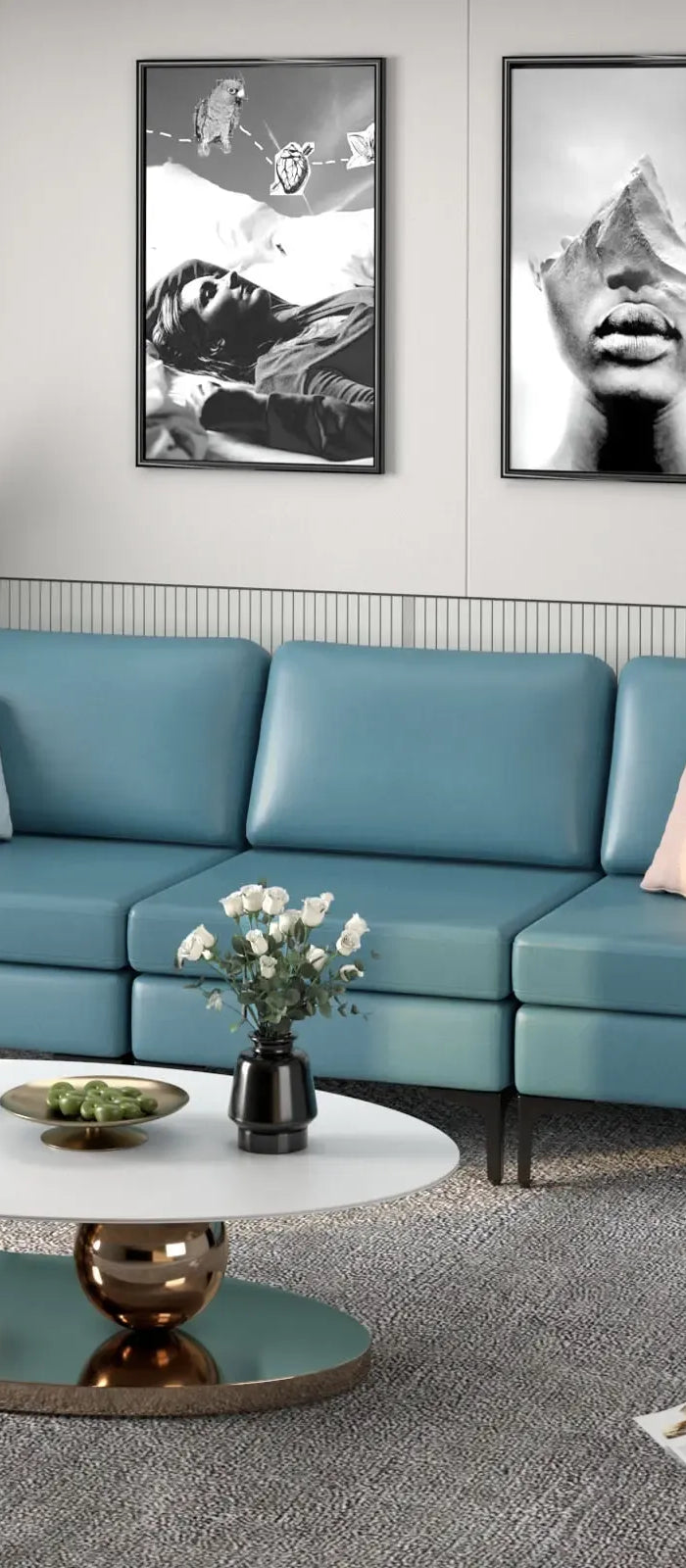 Modern living room with a blue sofa, coffee table, and decorative items.