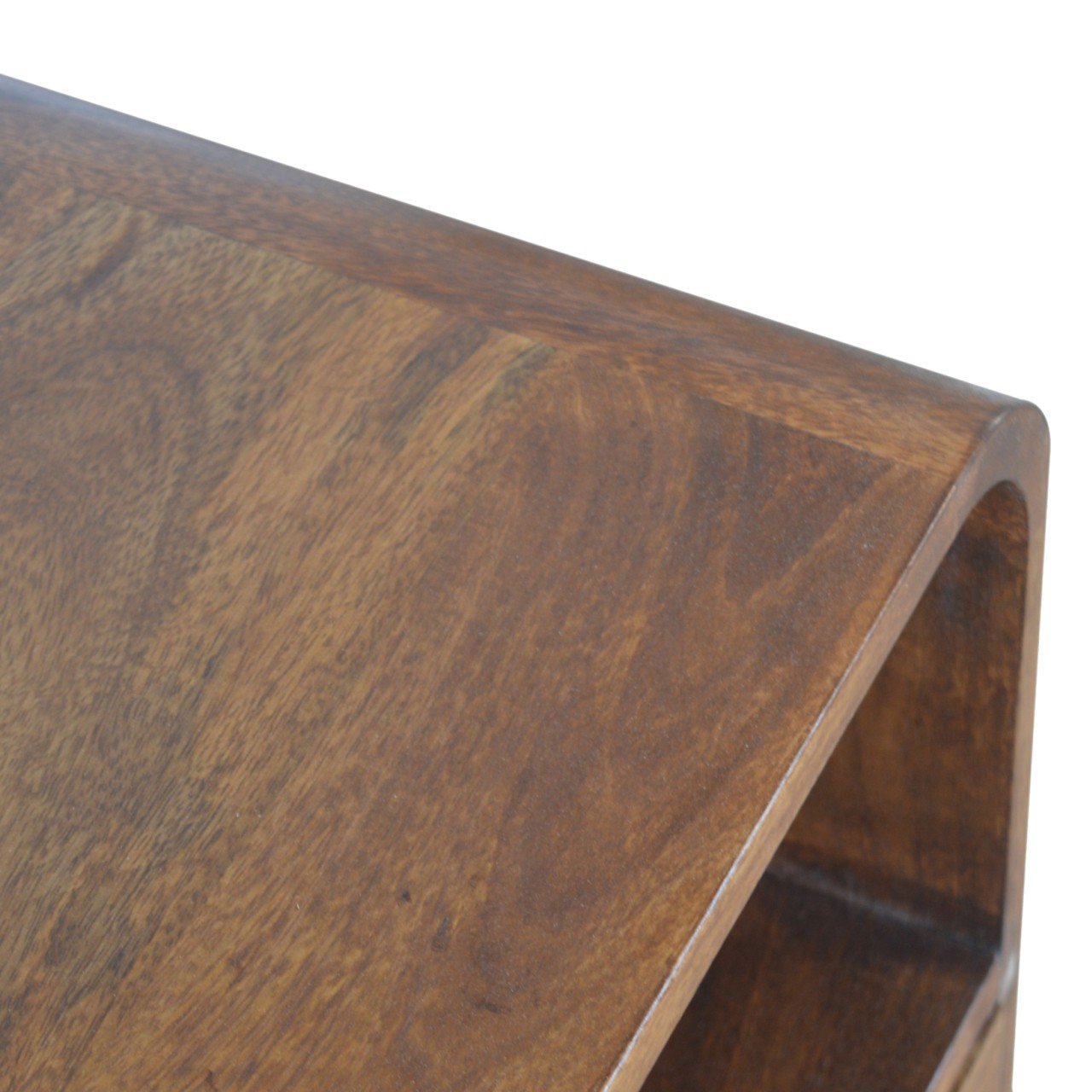 Chestnut Curved Edge Nightstand made from solid mango wood with drawer and two open storage slots. Top edge view