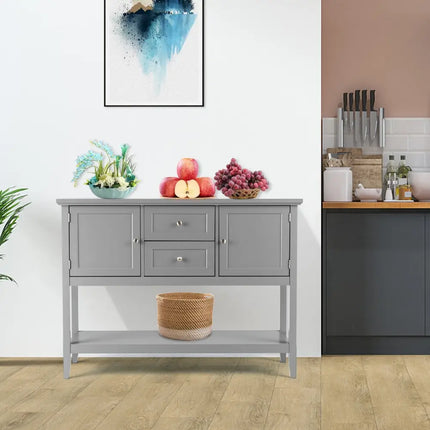 Gray sideboard in a kitchen with fruit and decor items on top